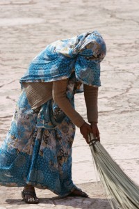 Woman sweeping--our drivers could tell us a person's caste by seeing what they do